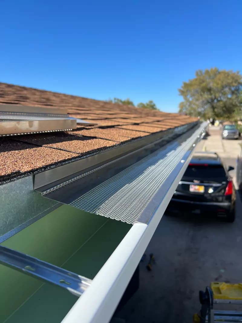 Close-up view of a micro-mesh gutter guard system